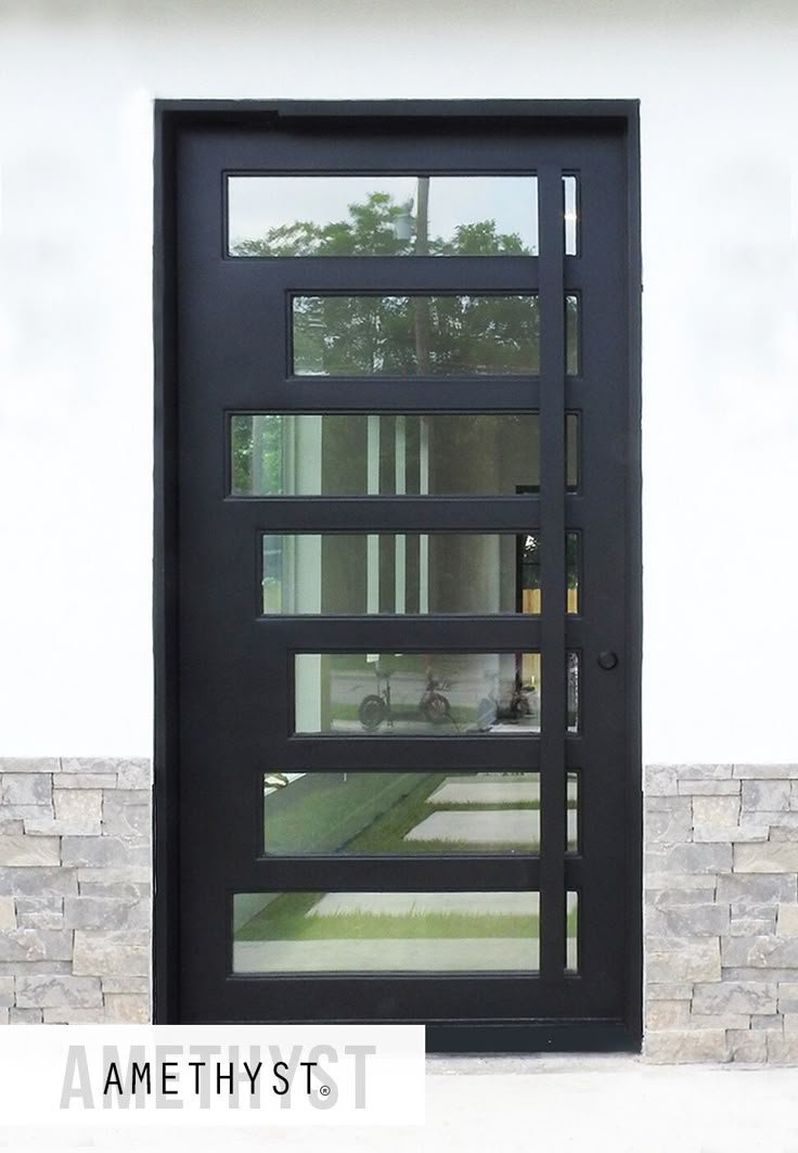 Aluminum pivot door with large glass panel