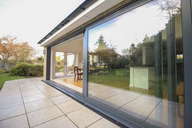 An open corner lift and slide door configuration